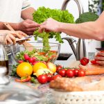 Family preparing lunch together at home